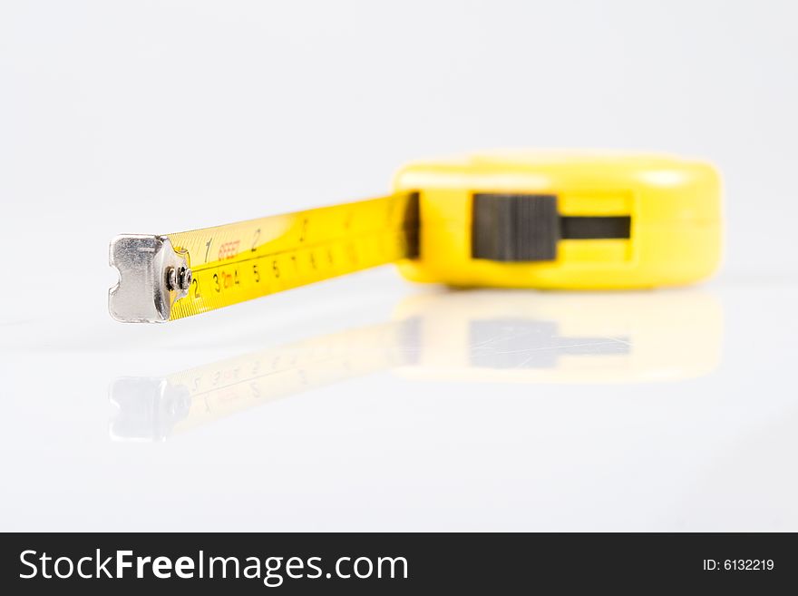 Yellow ruler isolated on white background