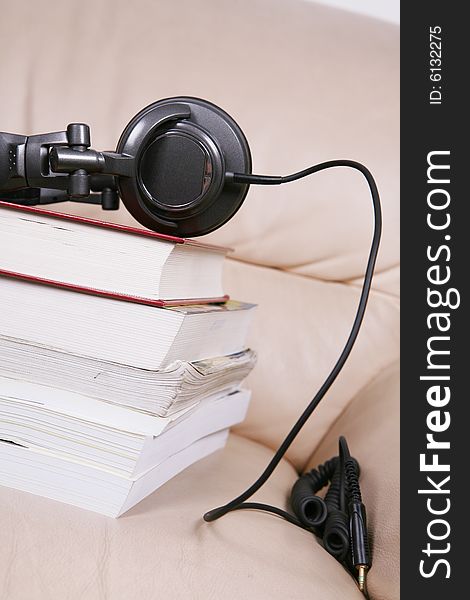 A black earphone with book