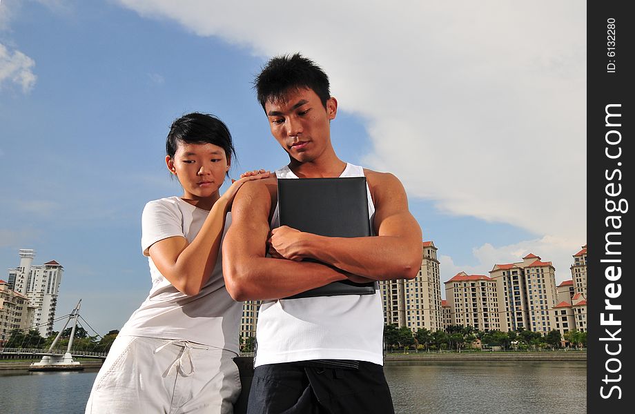 Picture of an urban couple making decisions. Picture of an urban couple making decisions.