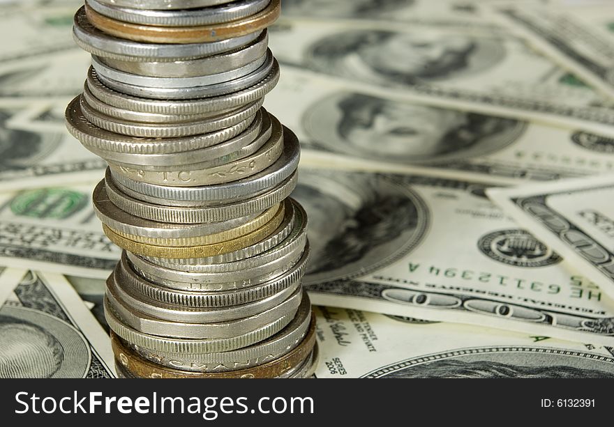 Coins isolated on dollars background. Coins isolated on dollars background