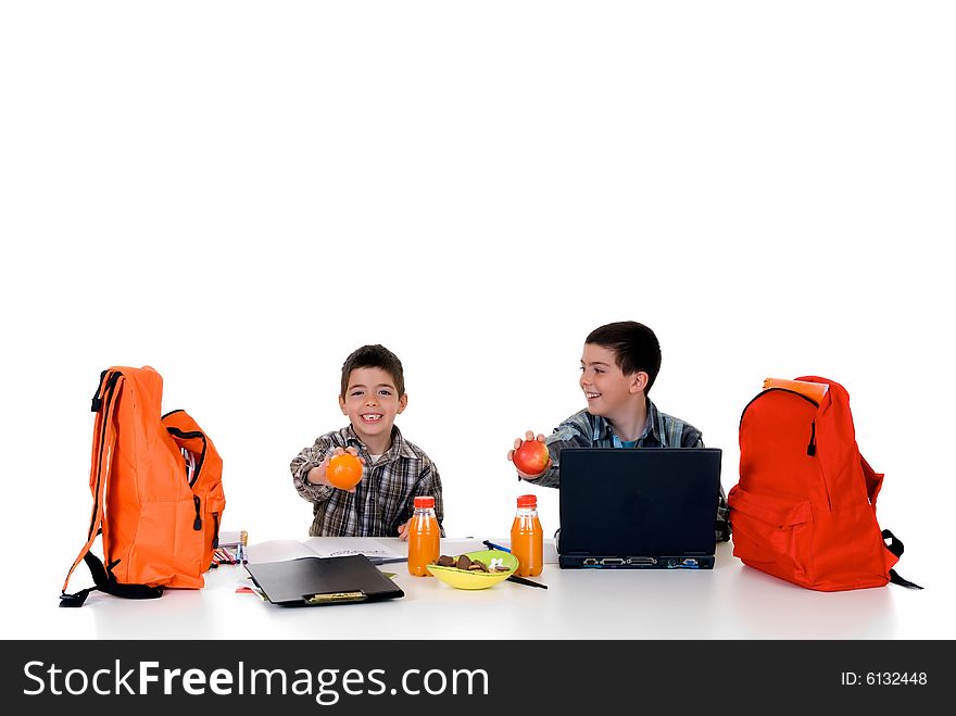 Two young boys doing together studying and homework. Two young boys doing together studying and homework