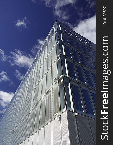 Modern corporate glass-fronted building in sunshine. Modern corporate glass-fronted building in sunshine