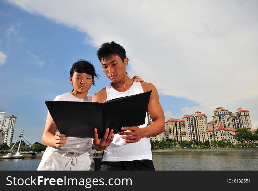 Picture of an urban couple making decisions. Picture of an urban couple making decisions.