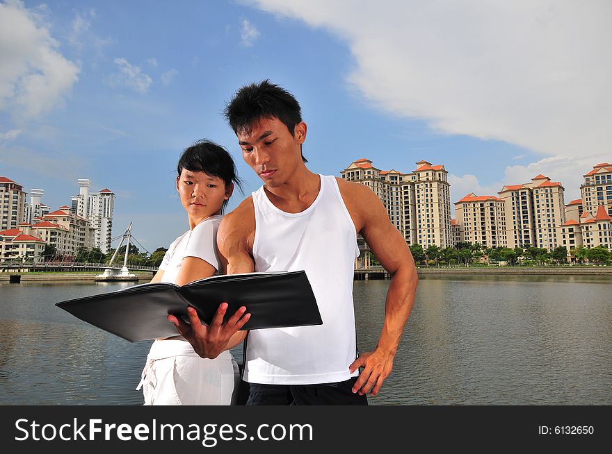 Picture of an urban couple making decisions. Picture of an urban couple making decisions.