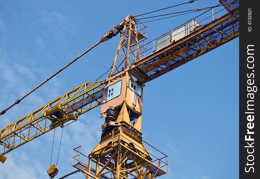 Construction site crane with view on a cabin. Construction site crane with view on a cabin