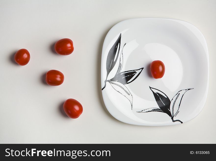 Cherry tomatoes on white paper