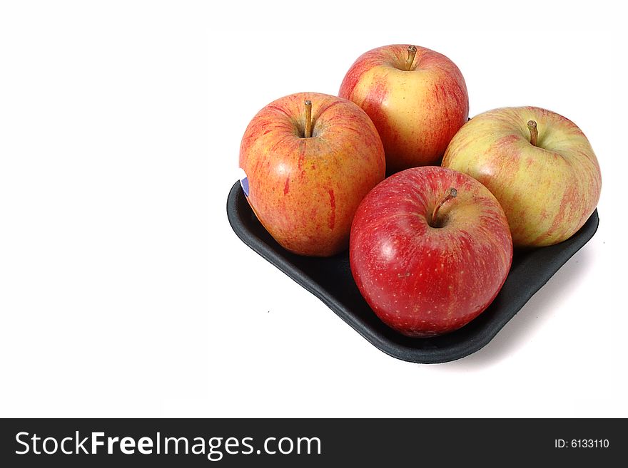 Fresh red apples brightly lit on isolated white background