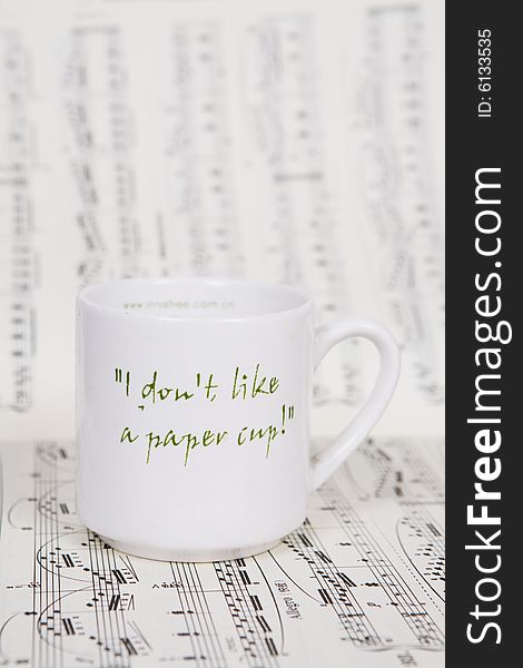 A cup of coffee on Music score