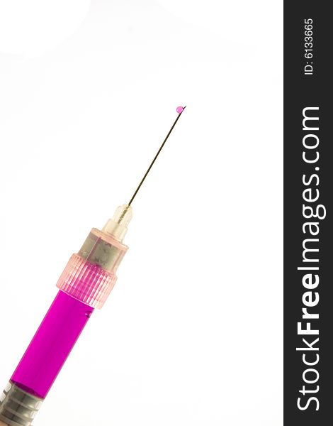 Syringe filled with the pink liquid