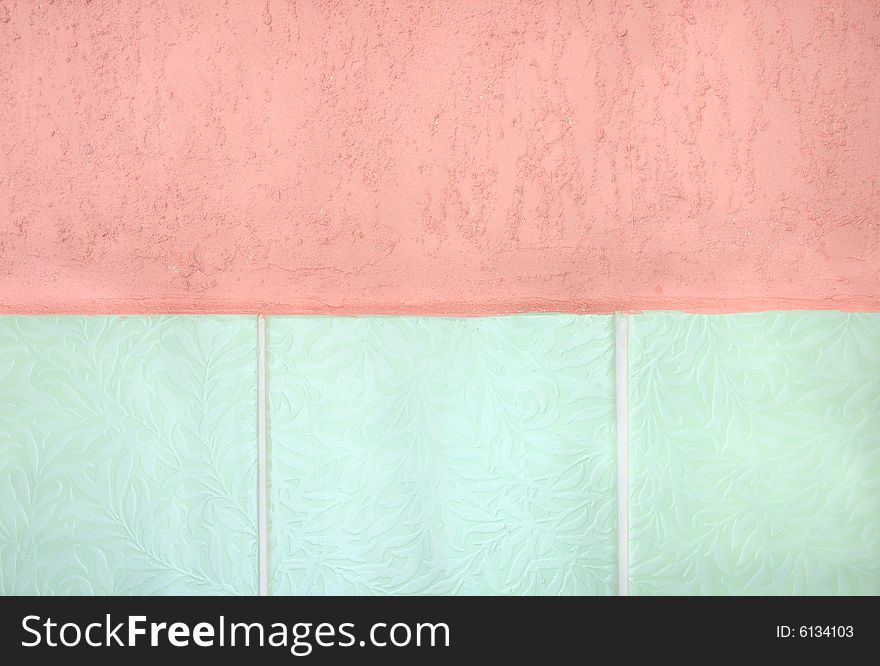 Pink Stucco And Green Tiled Wall.