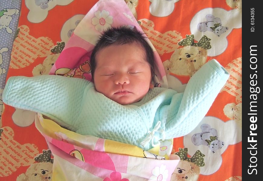 Sleeping Baby on a bed