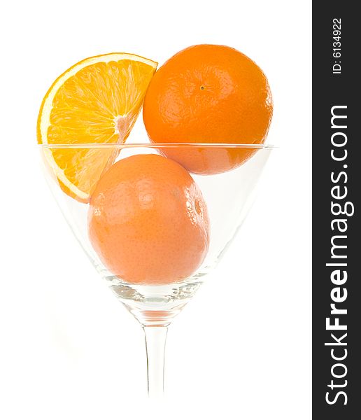 Mandarins in glass isolated on white background