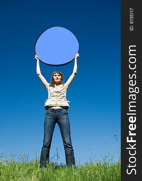 The girl in the field with dark blue circle over a head (place for an inscription). The girl in the field with dark blue circle over a head (place for an inscription)