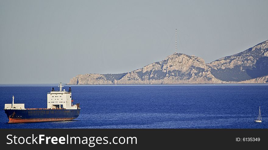 View of a cargo boat in Sardinian sea.