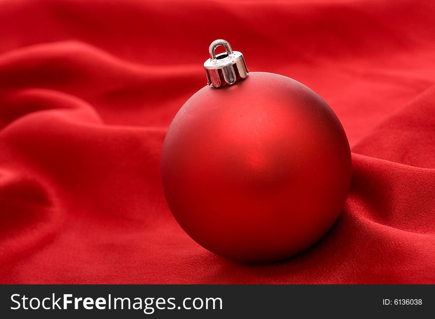 Red ball on red background - Christmas decoration. Red ball on red background - Christmas decoration