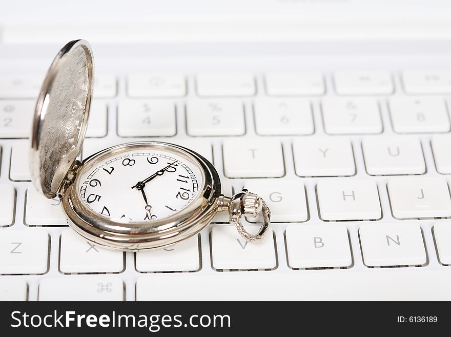 Pocket watch with white keyboard. Pocket watch with white keyboard