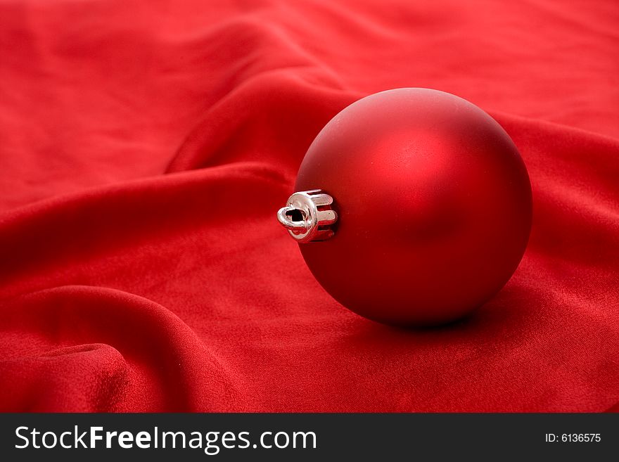 Red ball on red background - Christmas decoration. Red ball on red background - Christmas decoration