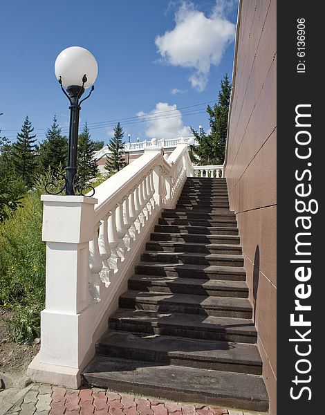 Ladder with a lantern and white balustrade. Ladder with a lantern and white balustrade.