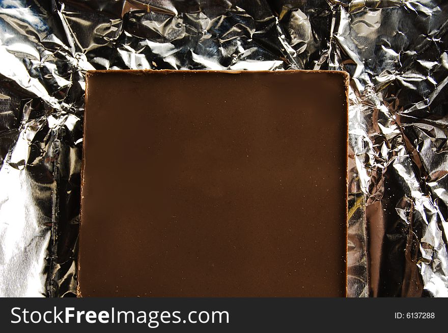 Slice of chocolate on a foil