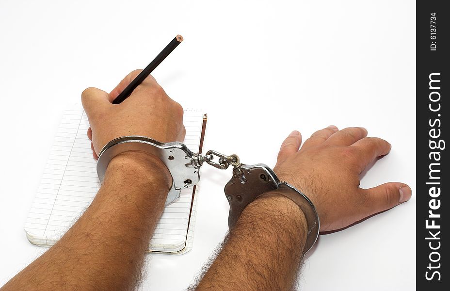 Hands with handcuffs close up