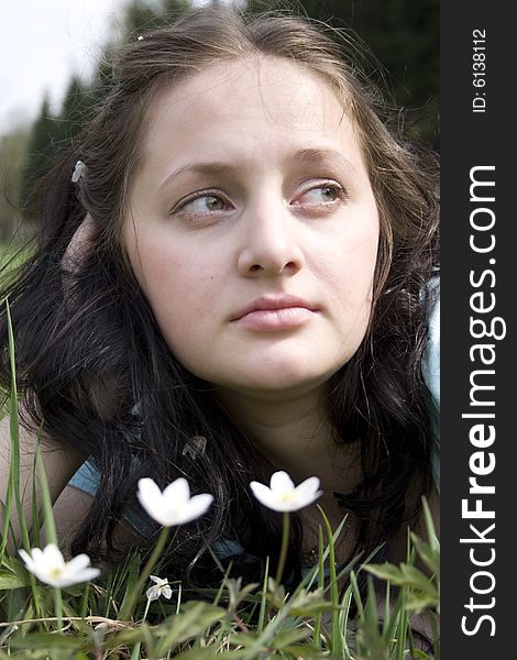 Young woman lying on grass