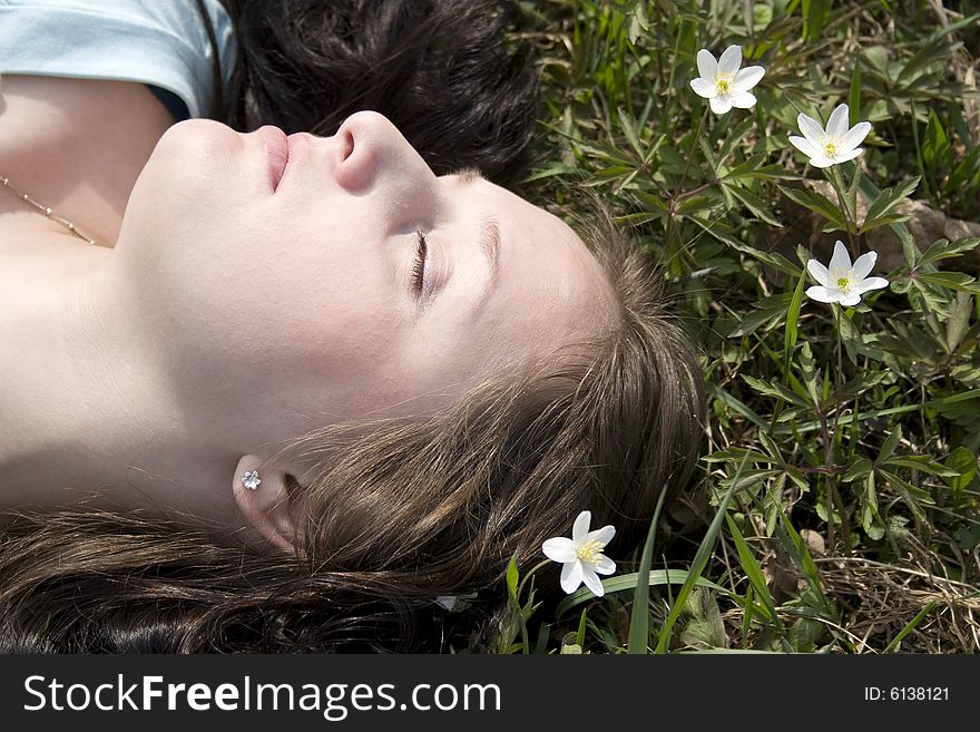 Young woman lying on grass