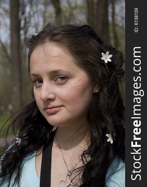 Young woman with white flowers in hair
