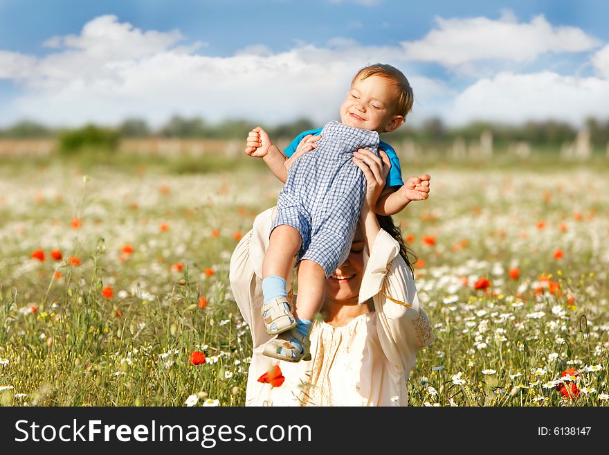 Mother and son on natural background