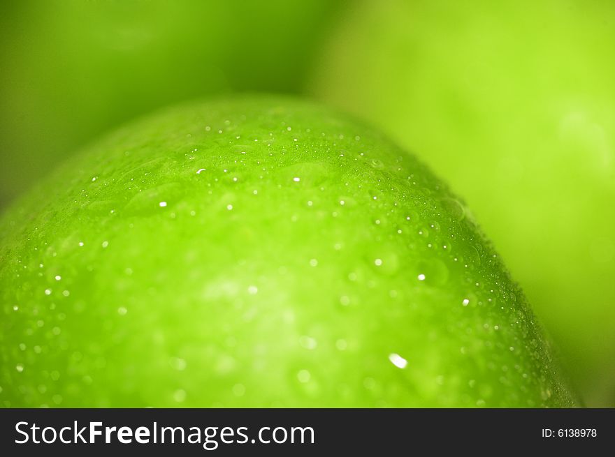 Close-up green apple with waterdrops