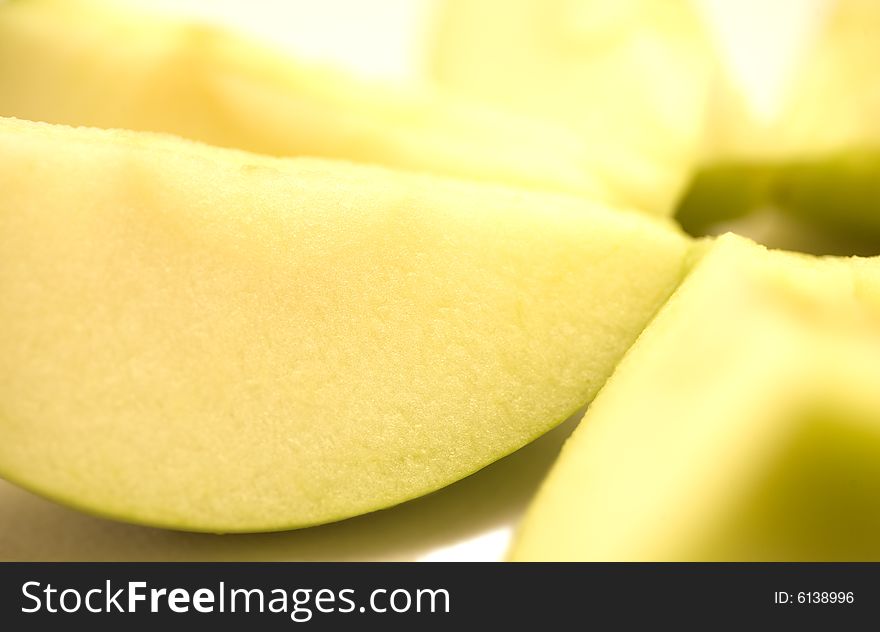 A few slices of apple on a white background. A few slices of apple on a white background