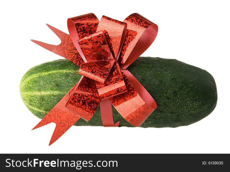 Green fresh cucumber bound with red bow. Green fresh cucumber bound with red bow