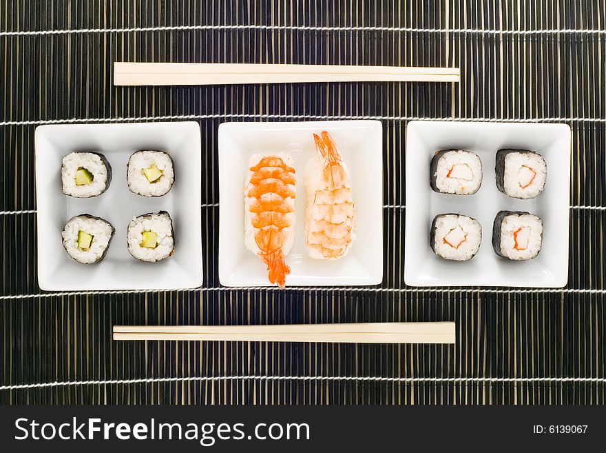 Three plates with different kinds of sushi