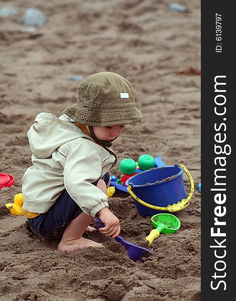 Boy Playing in Sand