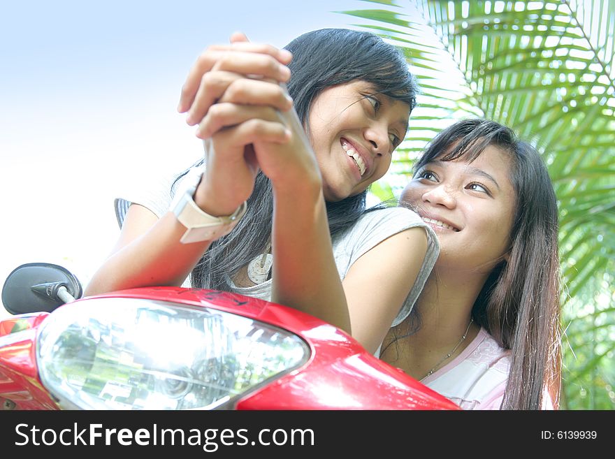 Girls having fun on bike