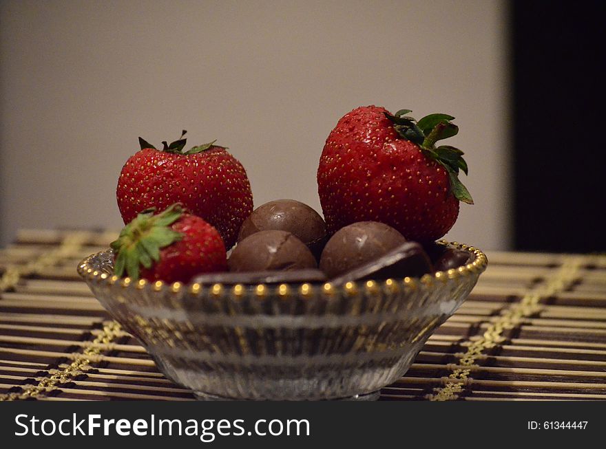 Chocolate and strawberries, sweet desert on a plate.