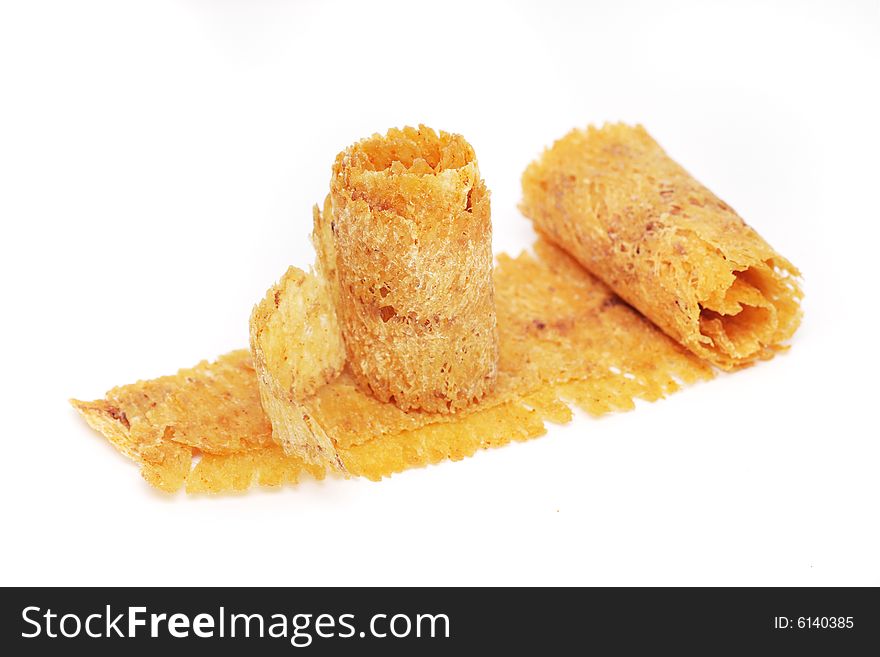 Dried and baked cuttlefish scroll on white background. Dried and baked cuttlefish scroll on white background.