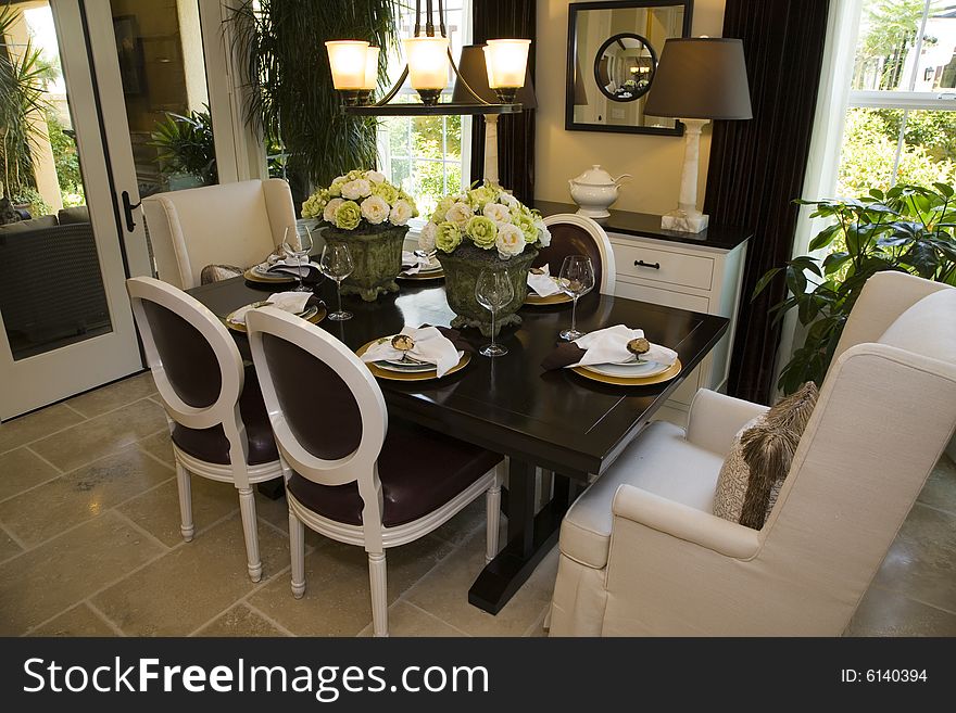 Dining room with modern tableware and decor. Dining room with modern tableware and decor.