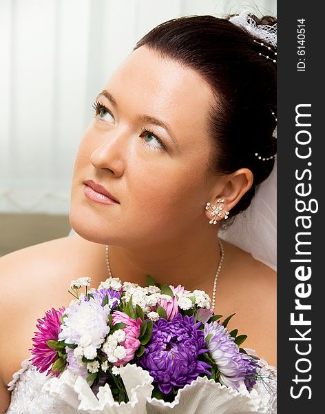 Portrait of a beautiful bride with flowers