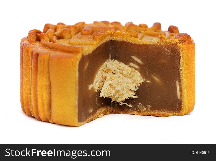 Close up of sliced mooncake over white background.