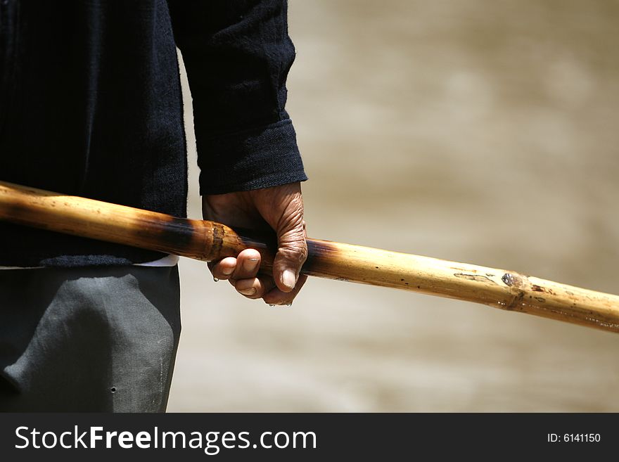 An old man do canoe in a river