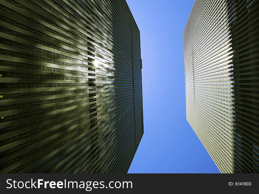 Modern office buildings in New York over blue sky. Modern office buildings in New York over blue sky