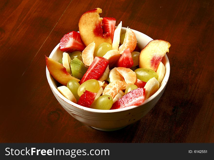 The ceramic full bowl of fruit. The ceramic full bowl of fruit