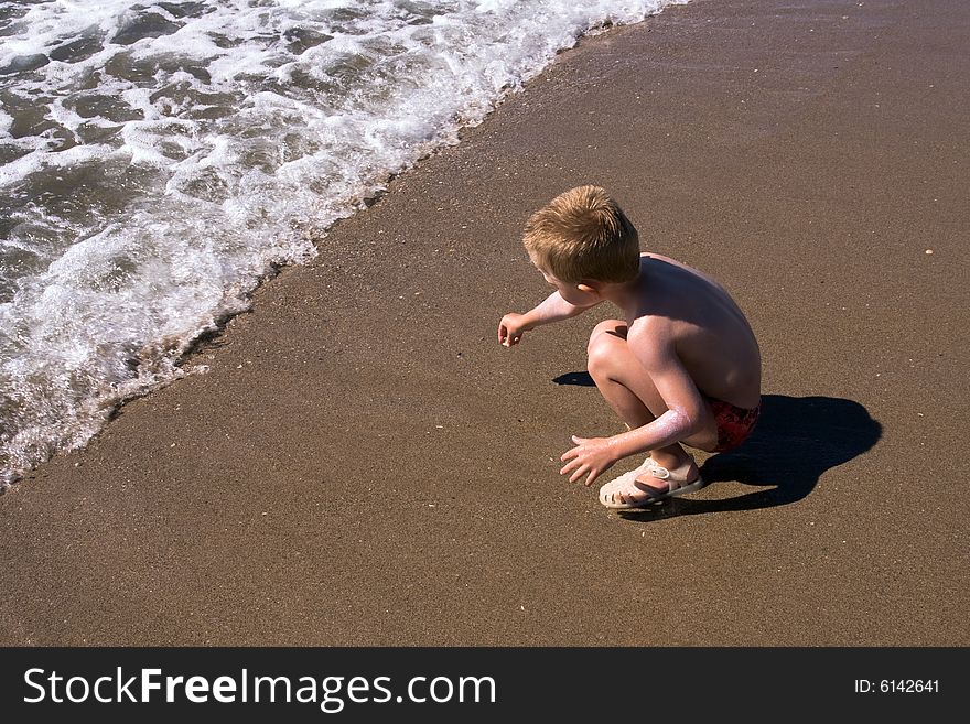 Child playing on the beach. Child playing on the beach