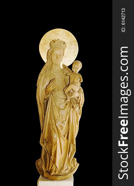 A wooden figure of Maria with the Jesus child in her arms. A wooden figure of Maria with the Jesus child in her arms