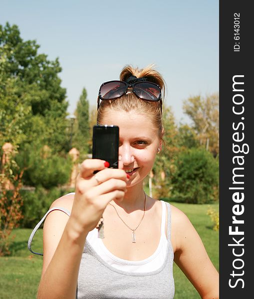 The beautiful girl with the mobile telephone