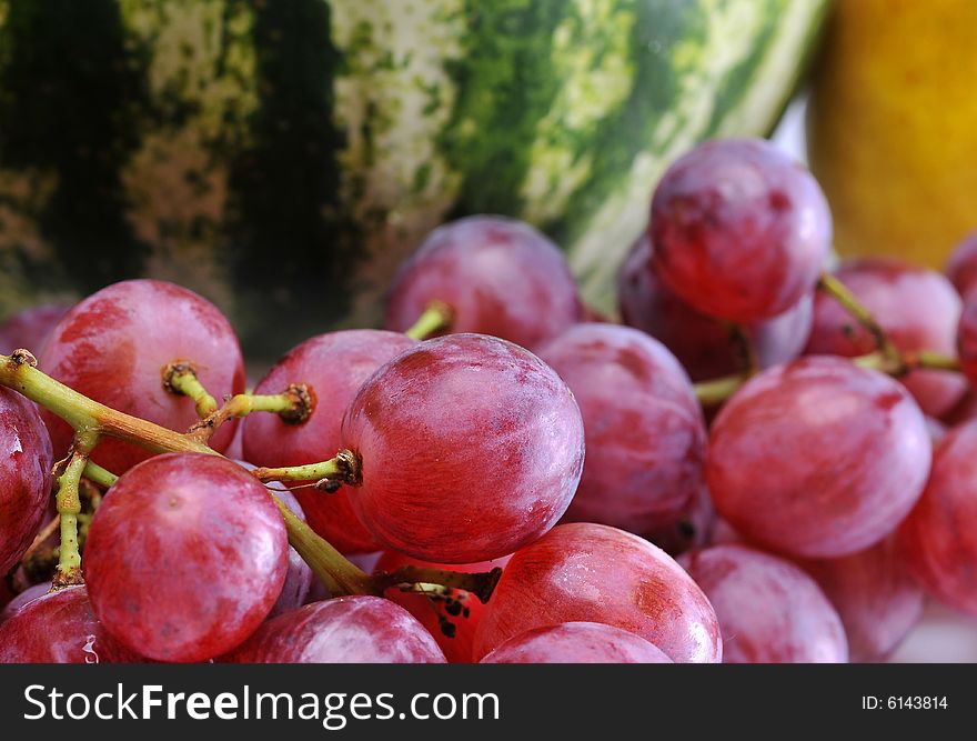 Variety of fresh colorful fruits on background