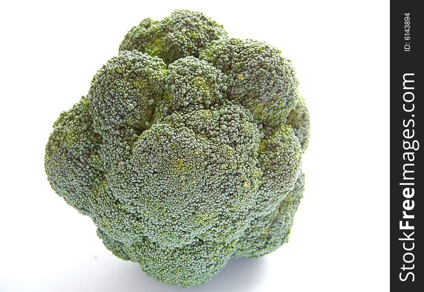 Green broccoli against white background