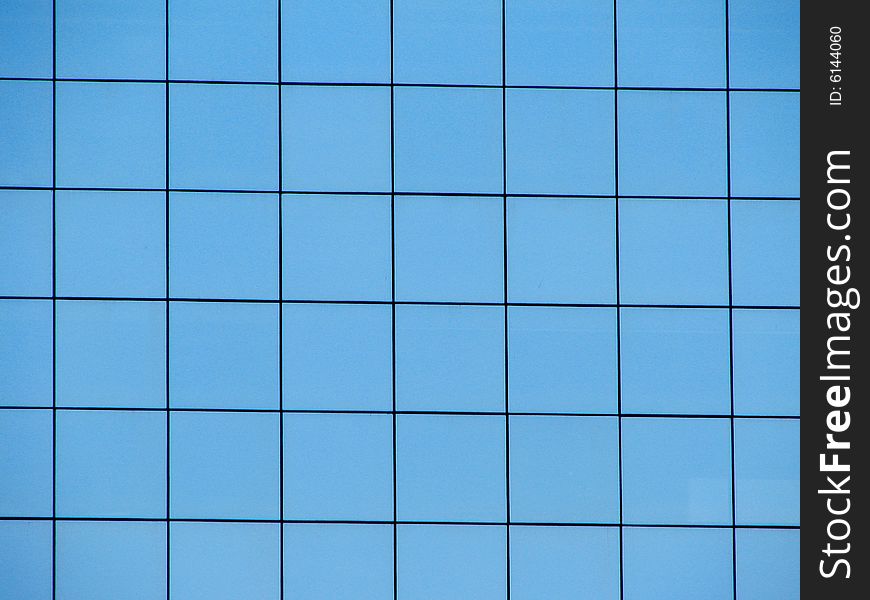 Windows of office building reflecting the sky. Windows of office building reflecting the sky