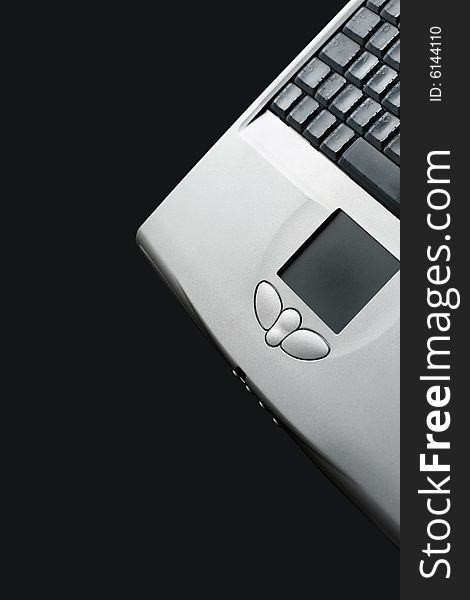 Modern laptop keyboard on black background