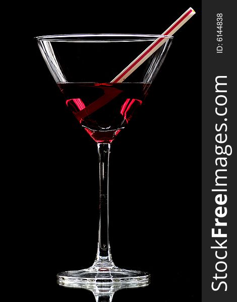 Red cocktail on black background